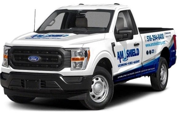 A.M. Shield Waterproofing branded truck showcasing waterproofing services and solutions for basement water damage prevention.